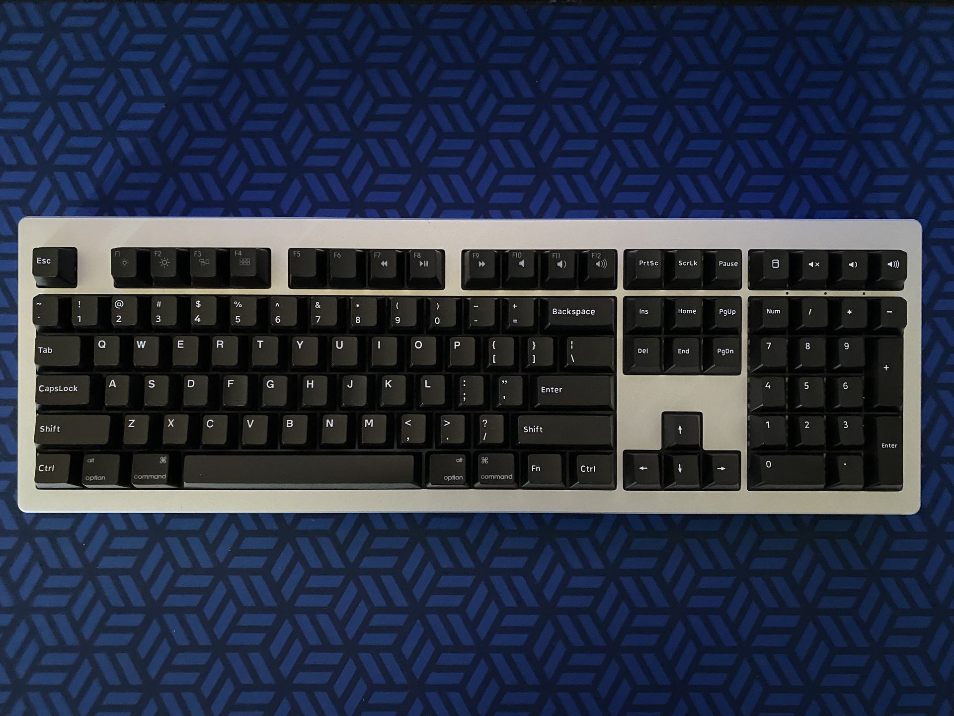 Custom dark mechanical keyboard build by Must Keebs