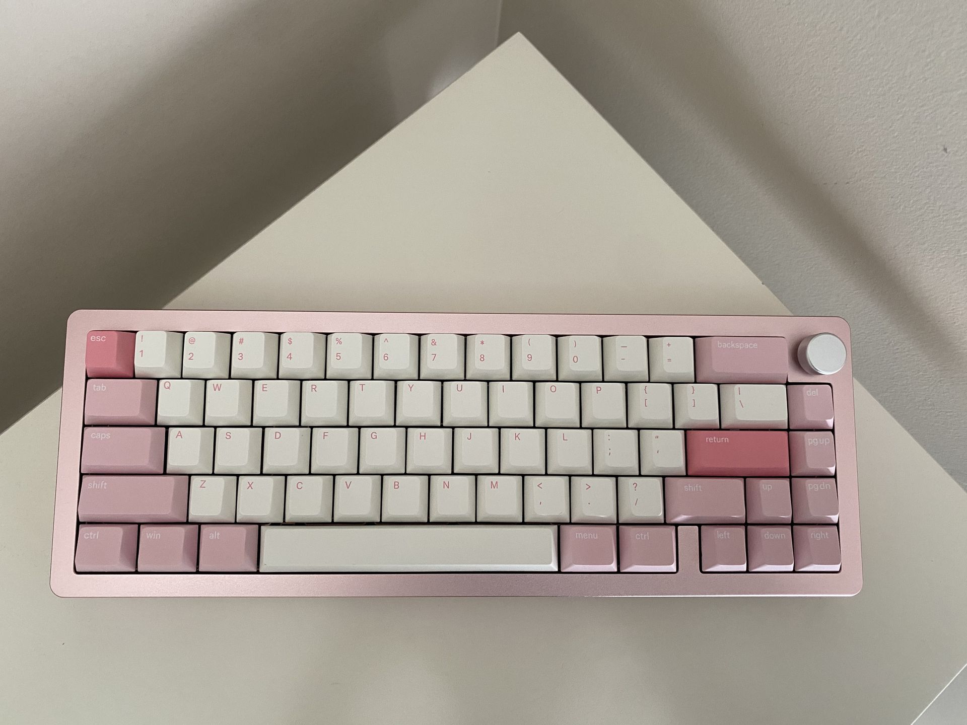 Custom mechanical keyboard with pink and white keycaps by Must Keebs